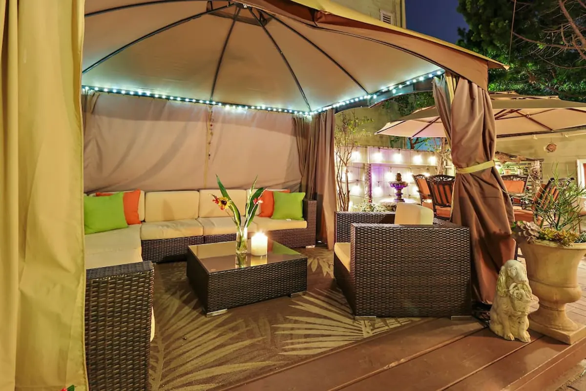 Covered cabana with LED lighting and lounge seating